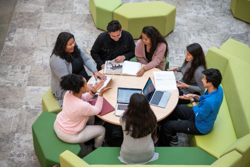 Students sitting around a round table for study group.